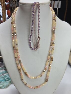 A beaded necklace and a beaded bracelet